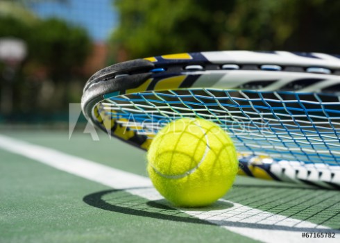 Picture of Close up view of tennis racket and balls on tennis court